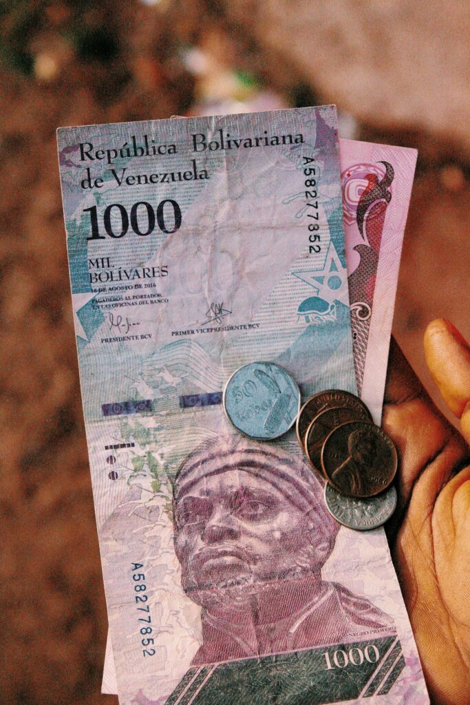Bolìvares coin and change Republica Bolivariana de Venezuela -  Richness poorness poverty money