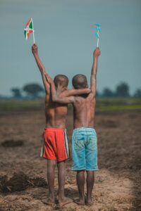 congo burundi children barefoot flags africa by Safari Consoler - pexels